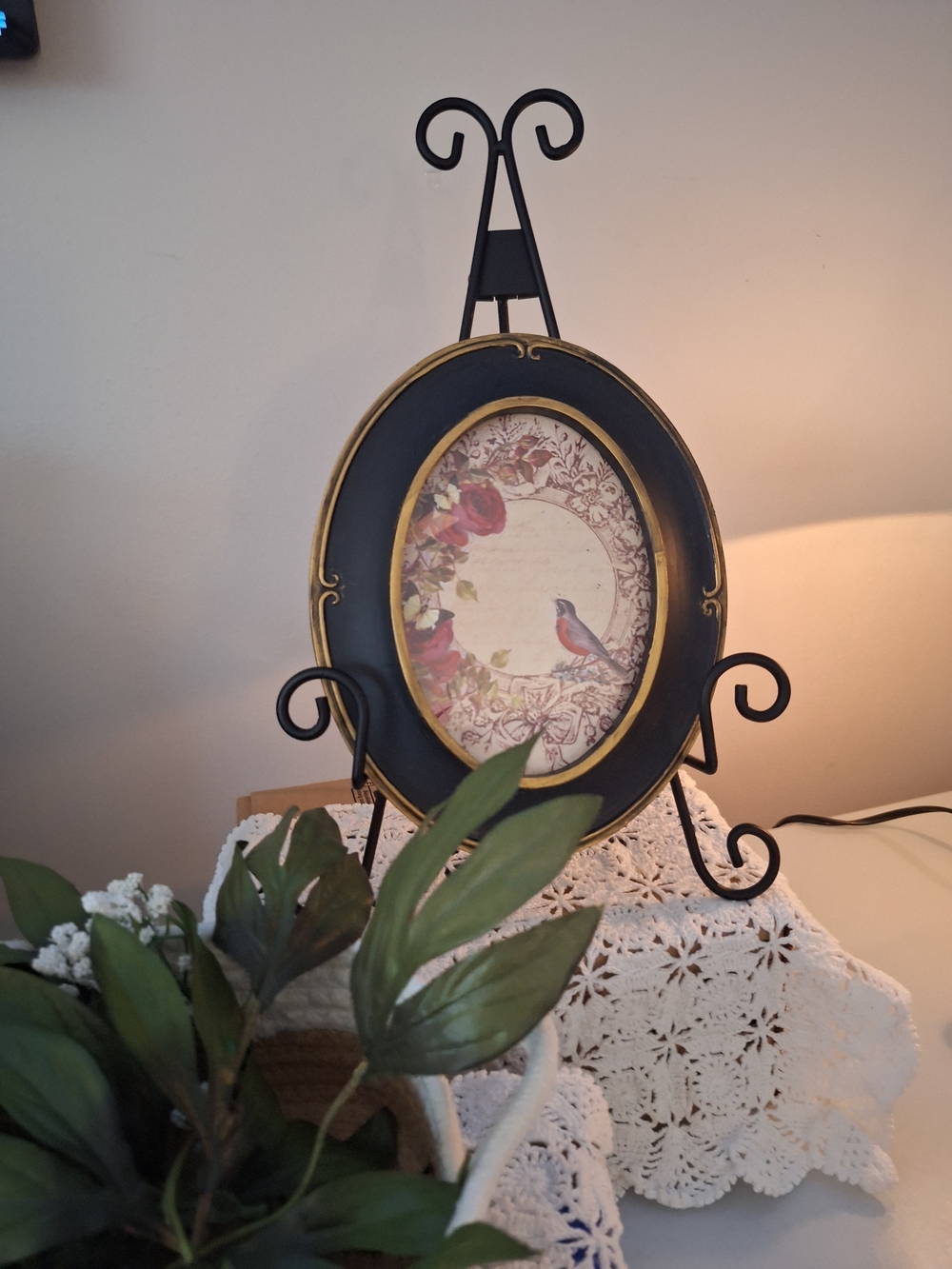 Black and Gold Oval Art Plate with Bird Illustration